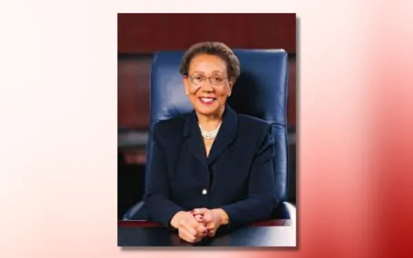 carolyn mahoney headshot on red and white ombre background