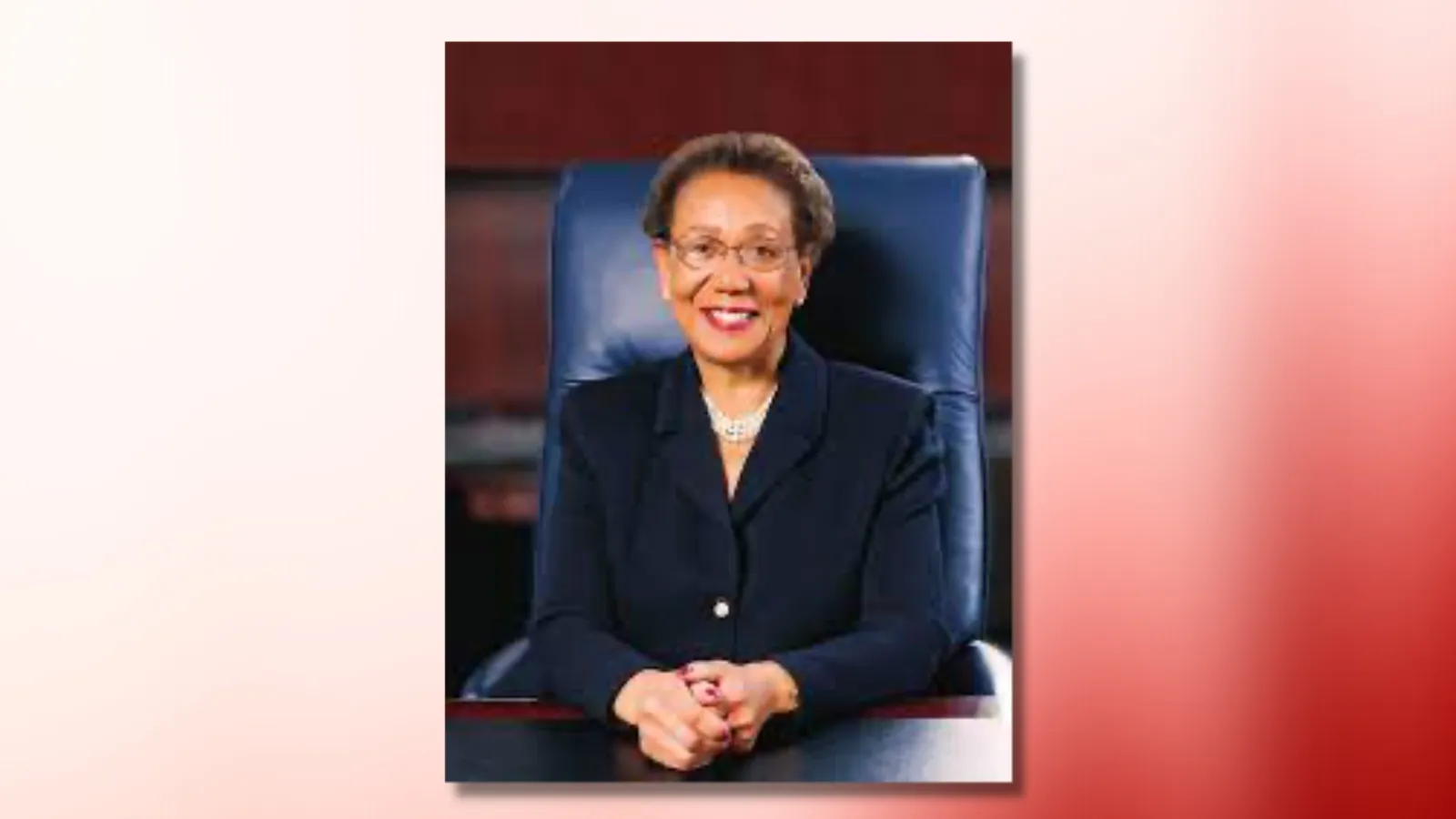 carolyn mahoney headshot on red and white ombre background