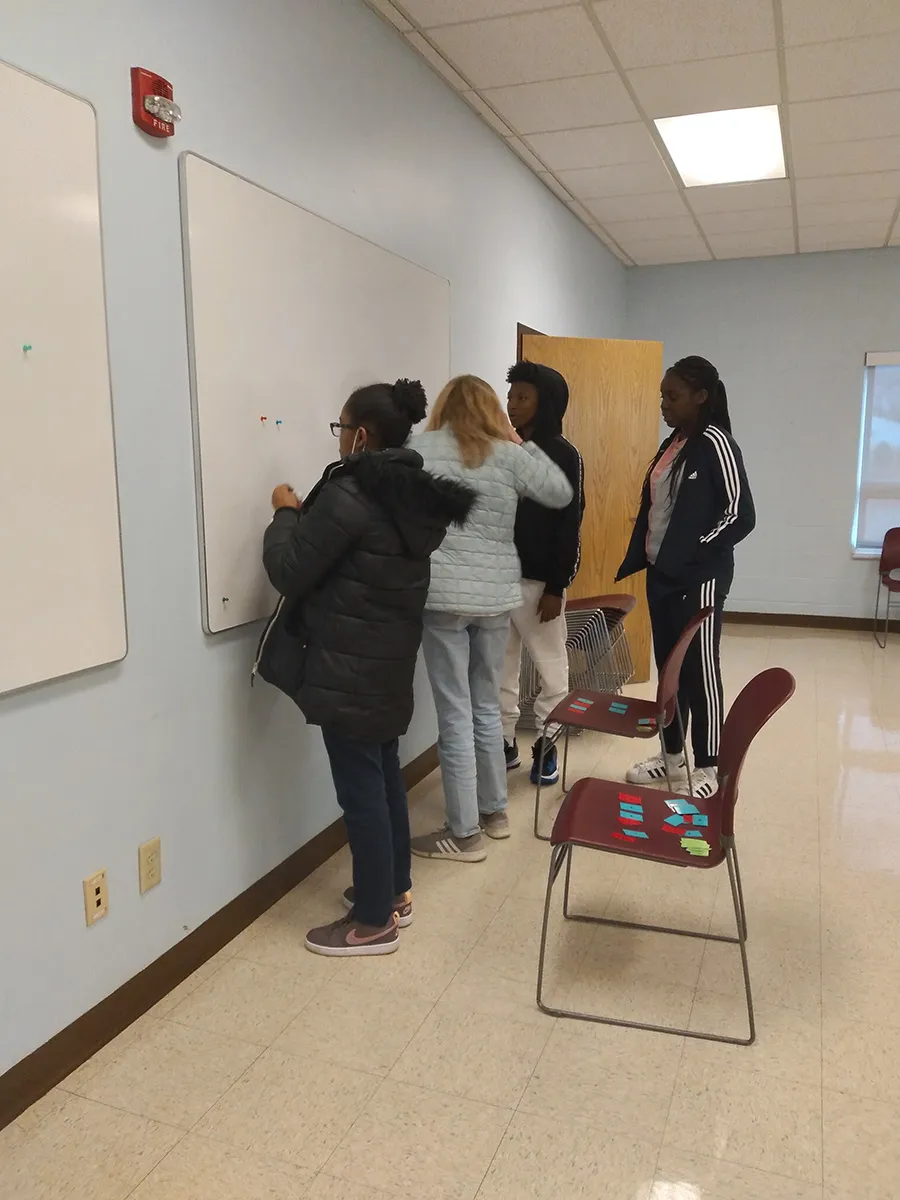 Students discussing the puzzle.