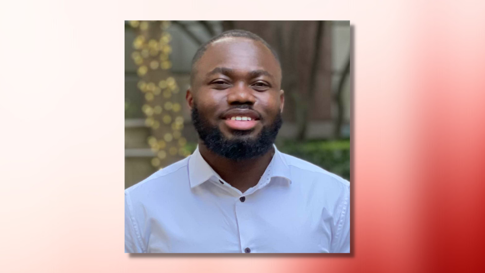 josiah hounyo headshot on red and white ombre background